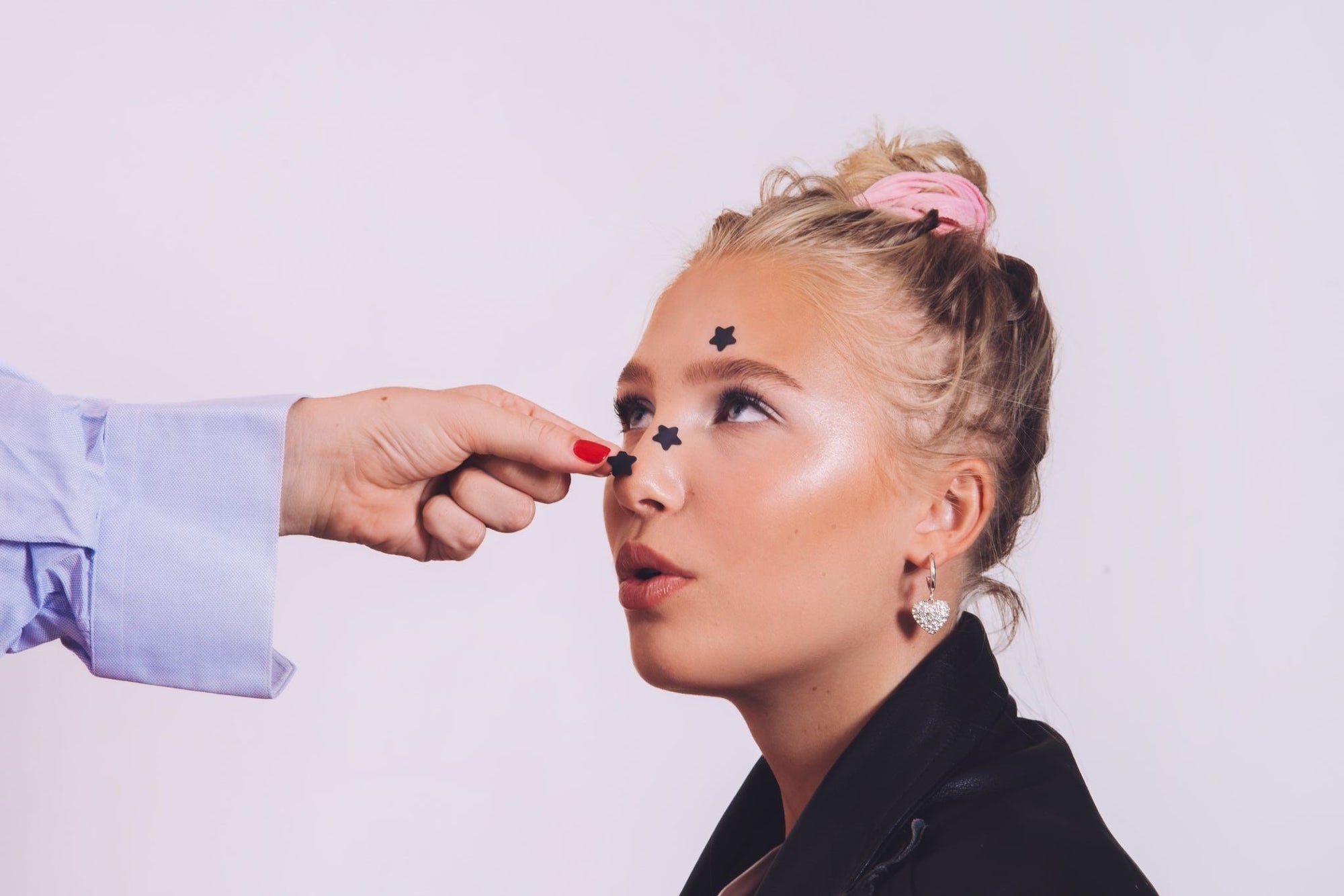 Young woman with Peggy World pimple patches